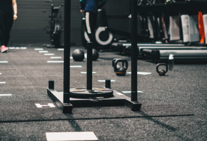 A modern, well-equipped gym Flooring Tiles